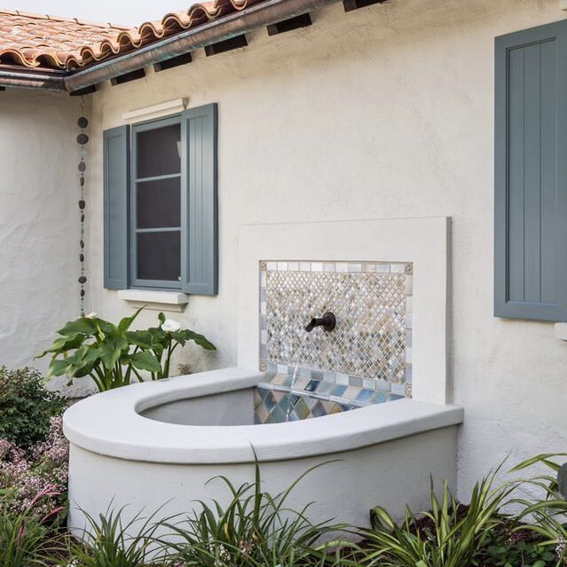 Santa Barbara classic Spanish exterior color palette with sparkling tiles on fountain