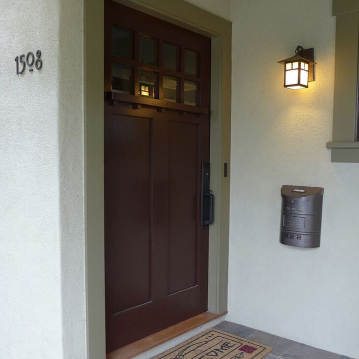 close up of custom front door on Pasadena craftsman in classic deep plum color